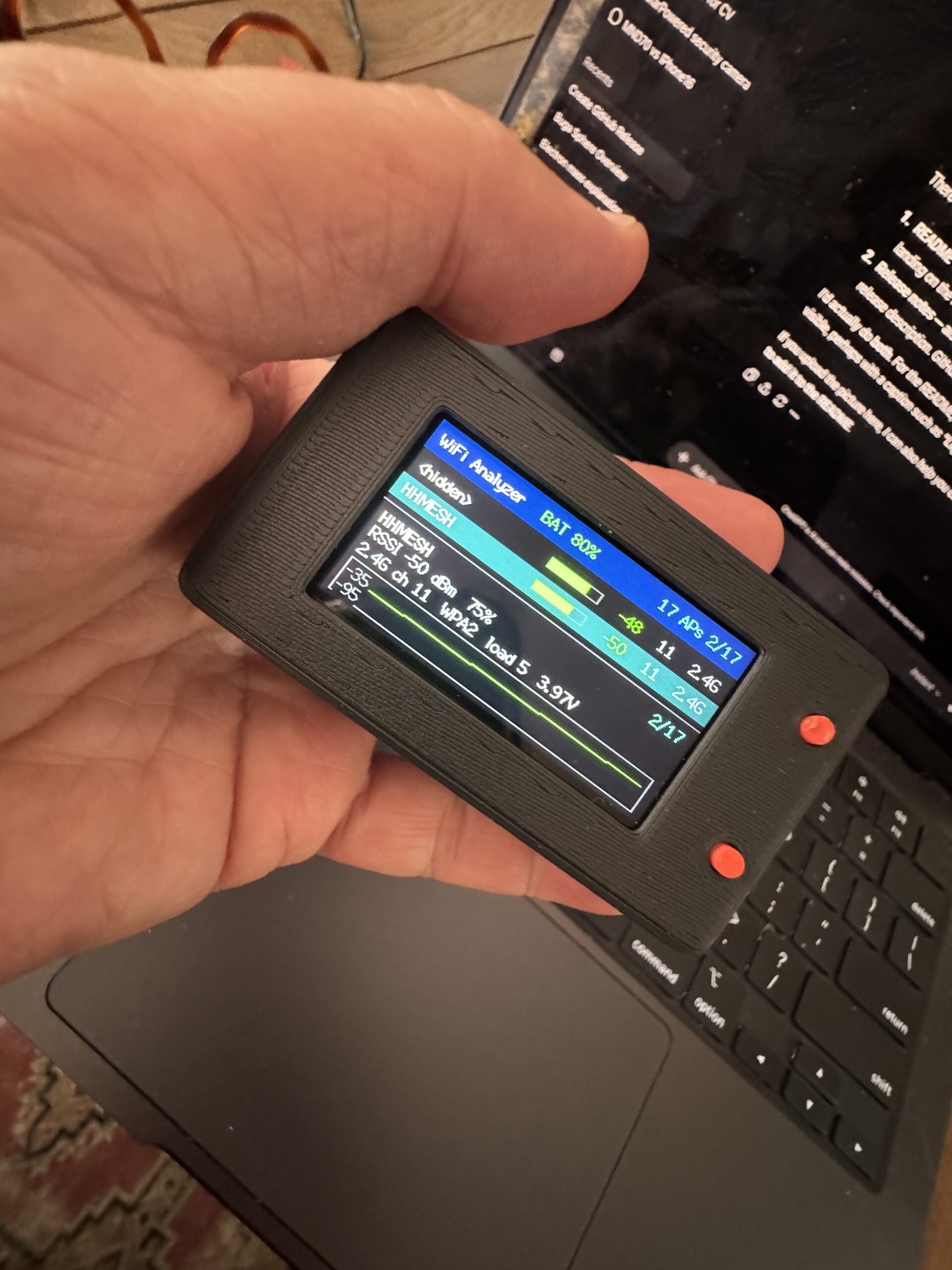 Pocket Prowler handheld scanner displaying WiFi network information in its black enclosure